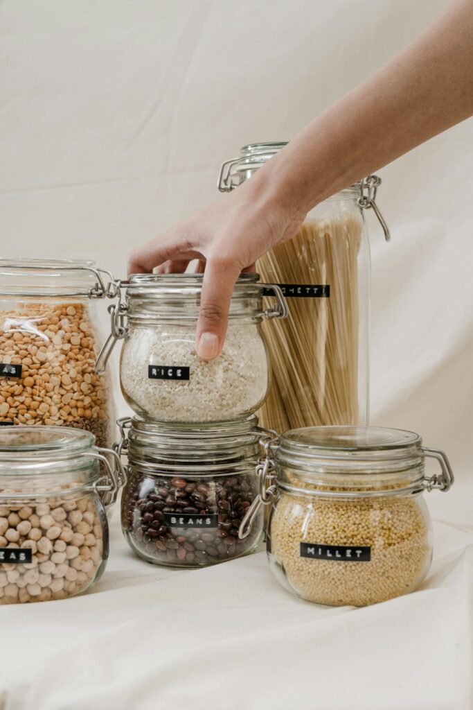 rRce or pasta in glass jars Photo by cottonbro studio Eco-friendly storage jars filled with grains, beans, and pasta, promoting a zero waste lifestyle.